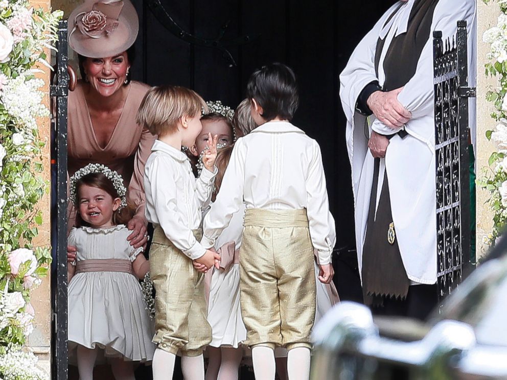 PHOTO: Kate, Duchess of Cambridge, left, stands with her daughter Princess Charlotte, bottom left, as they arrive for the wedding of Pippa Middleton and James Matthews at St Marks Church in Englefield, May 20, 2017.