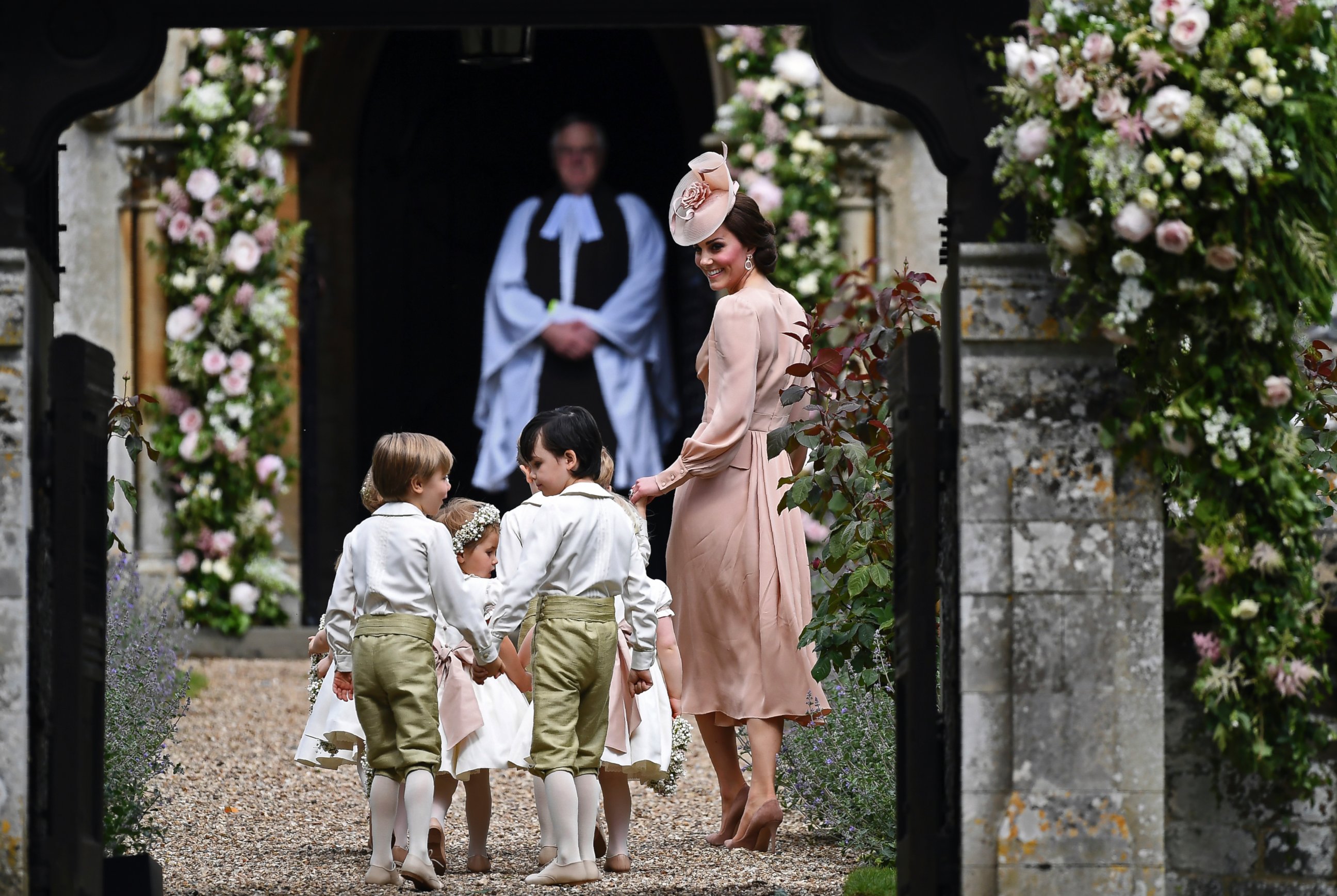 PHOTO: Catherine, Duchess of Cambridge, walks with the bridesmaids and pageboys as they arrive for her sister Pippa Middleton's wedding to James Matthews, at St Mark's Church in Englefield, England, May 20, 2017.