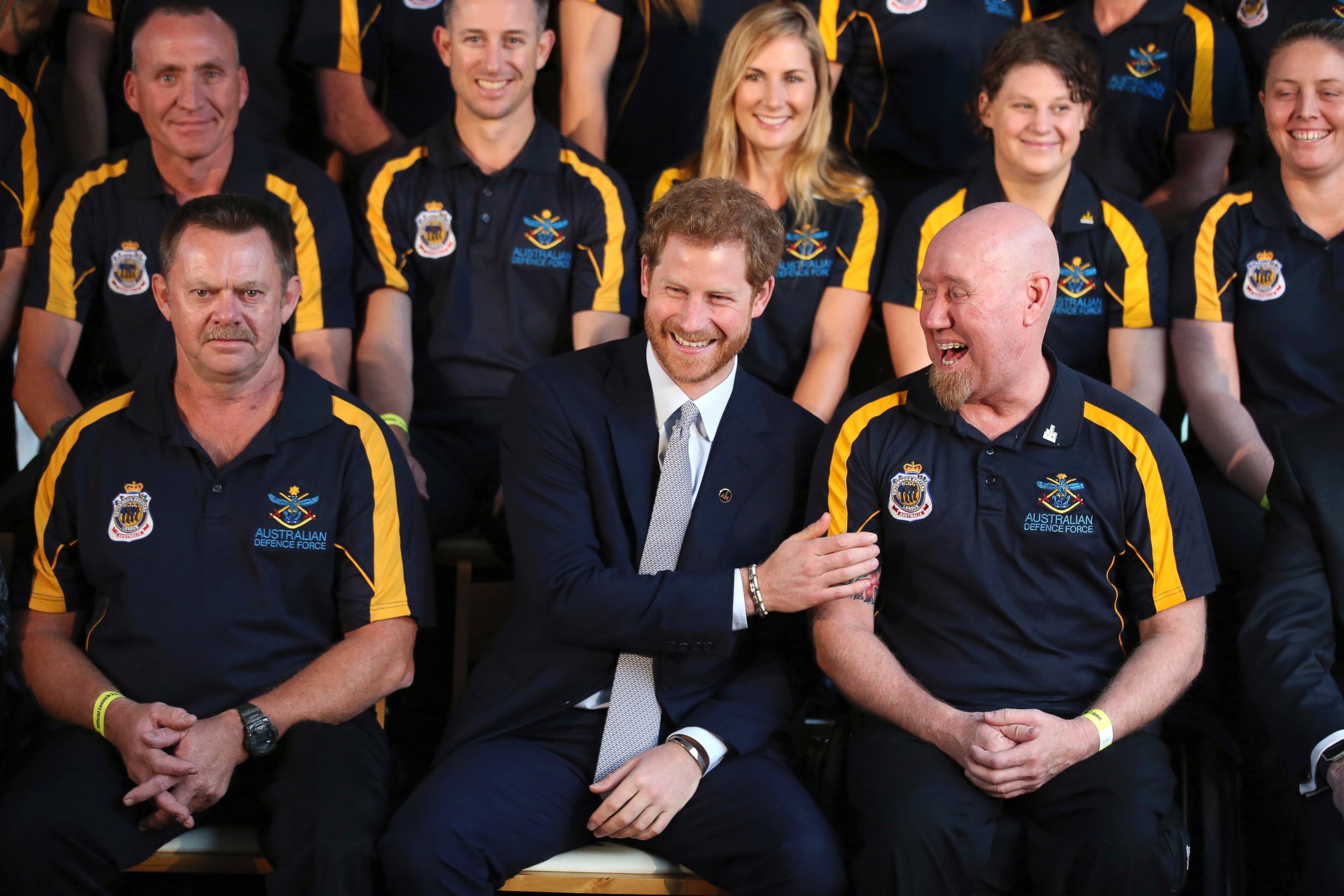 PHOTO: Britain's Prince Harry laughs with Jeff Wright during a photo opportunity at a function at Admiralty House in Sydney, June 7, 2017. Prince Harry is in Sydney to launch the 2018 Invictus Games.