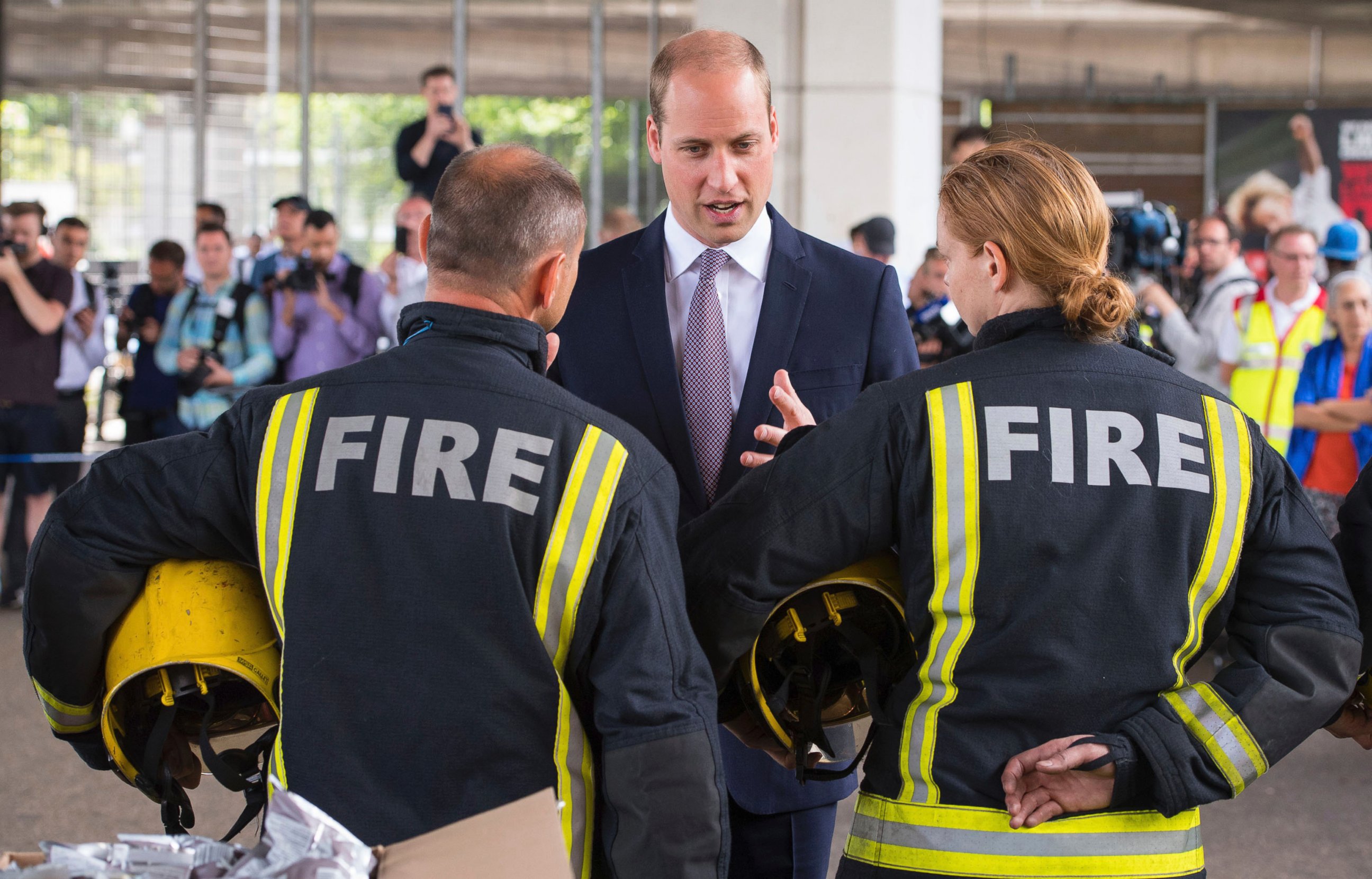 PHOTO: Britain's Prince William meets firefighters near Grenfell Tower, in London, June 16, 2017. 