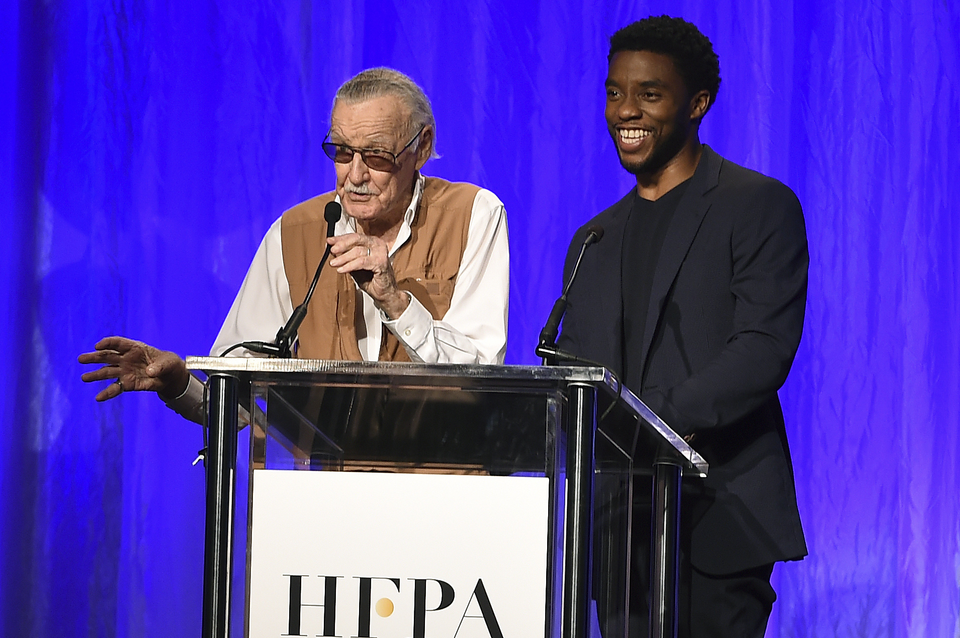 Stan Lee and Chadwick Boseman, of Marvel's "Black Panther," speak at the Hollywood Foreign Press Association Grants Banquet at the Beverly Wilshire Hotel on Wednesday, Aug. 2, 2017, in Beverly Hills, Calif.