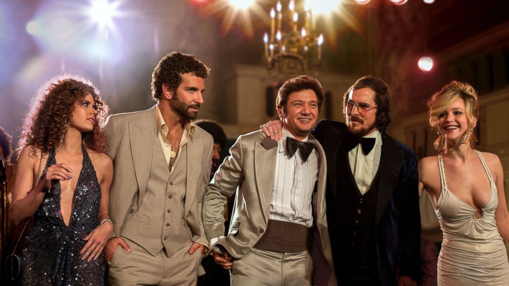 This film image released by Sony Pictures shows, from left,  Amy Adams, Bradley Cooper, Jeremy Renner, Christian Bale and Jennifer Lawrence in a scene from "American Hustle." 
