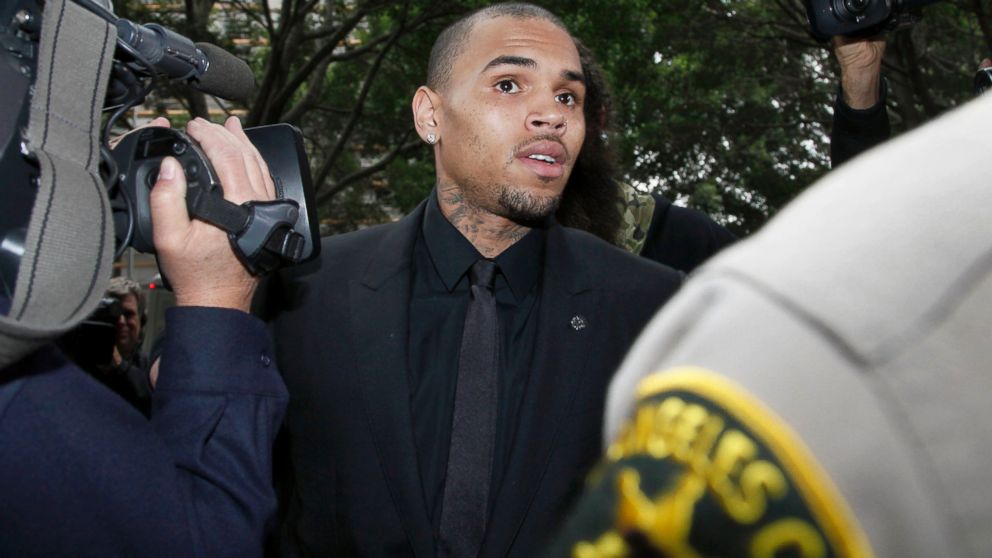 Singer Chris Brown arrives at court for a probation review hearing, Nov. 20, 2013, in Los Angeles.
