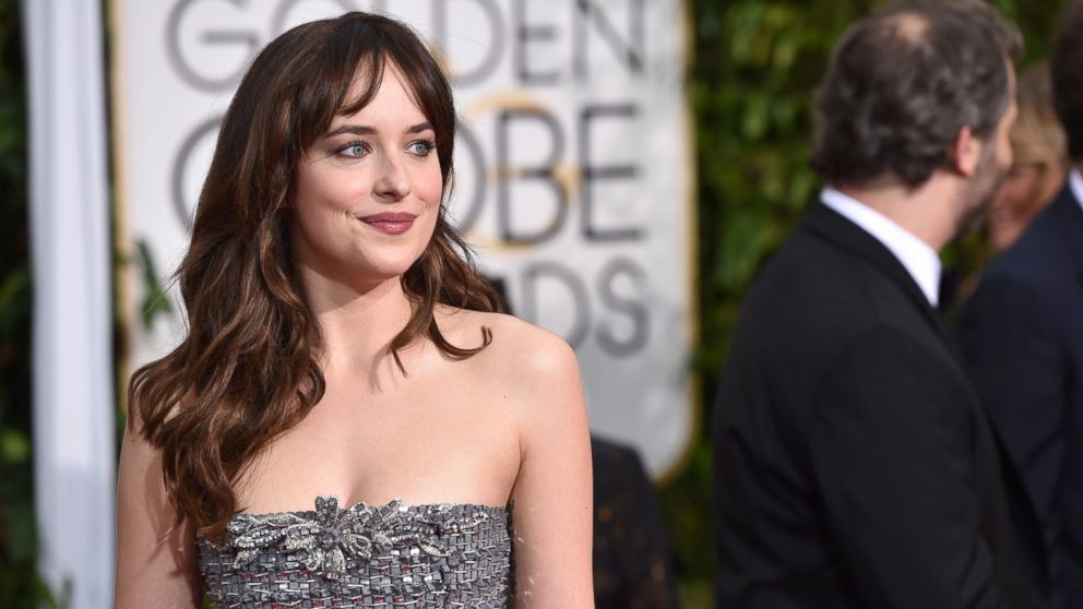 Dakota Johnson arrives at the 72nd annual Golden Globe Awards on Jan. 11, 2015, in Beverly Hills, Calif.