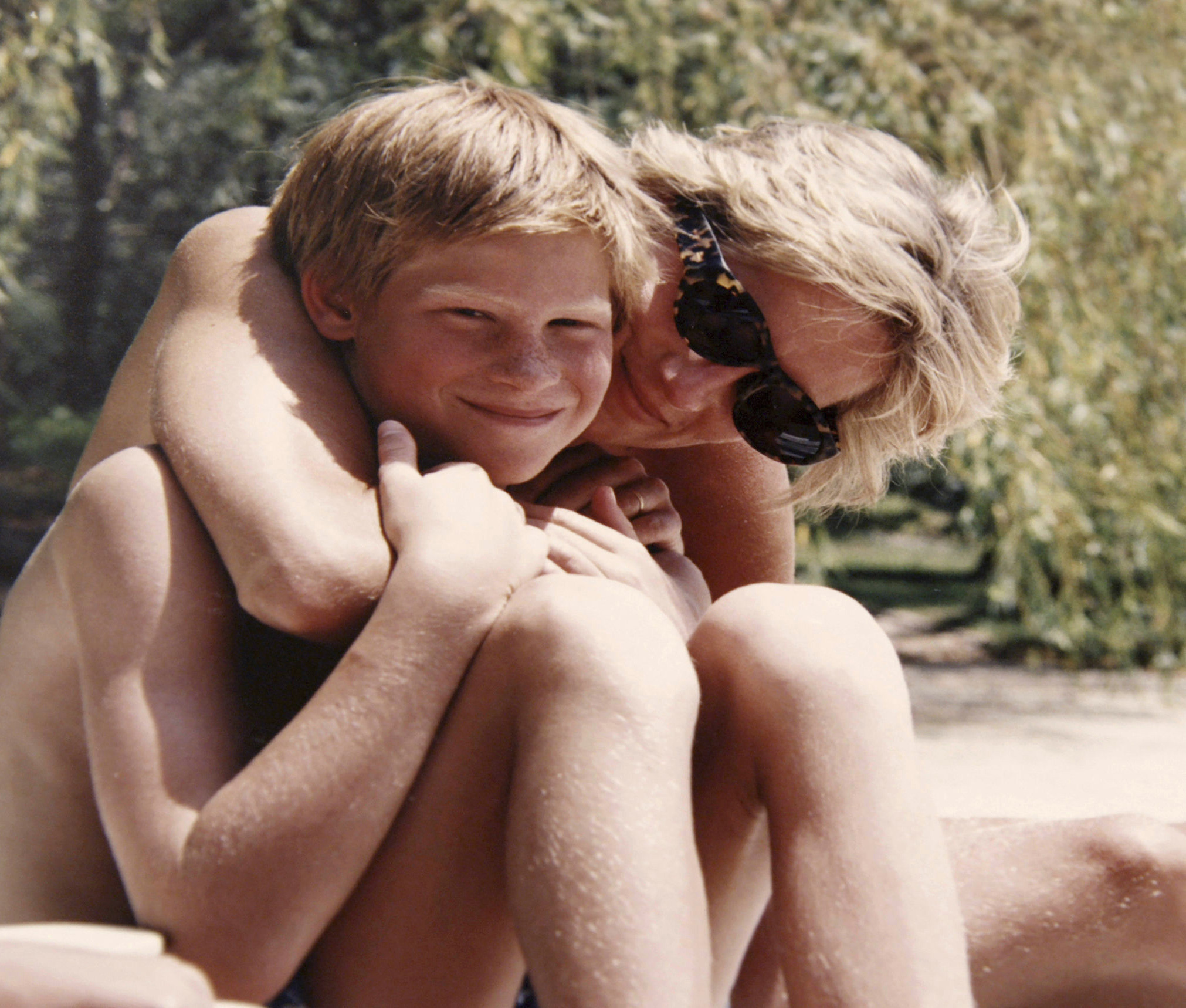 PHOTO: In this photo made available by Kensington Palace from the personal photo album of the late Diana, Princess of Wales, shows the princess and Prince Harry on holiday, and features in the new ITV documentary 'Diana, Our Mother: Her Life and Legacy.'