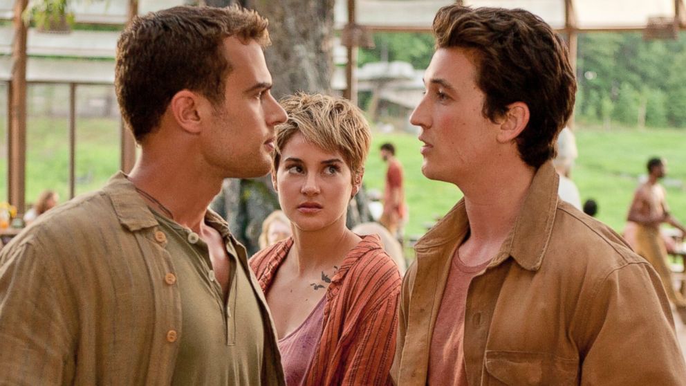 In this image released by Lionsgate, Theo James, from left, Shailene Woodley and Miles Teller appear in a scene from "The Divergent Series: Insurgent."
