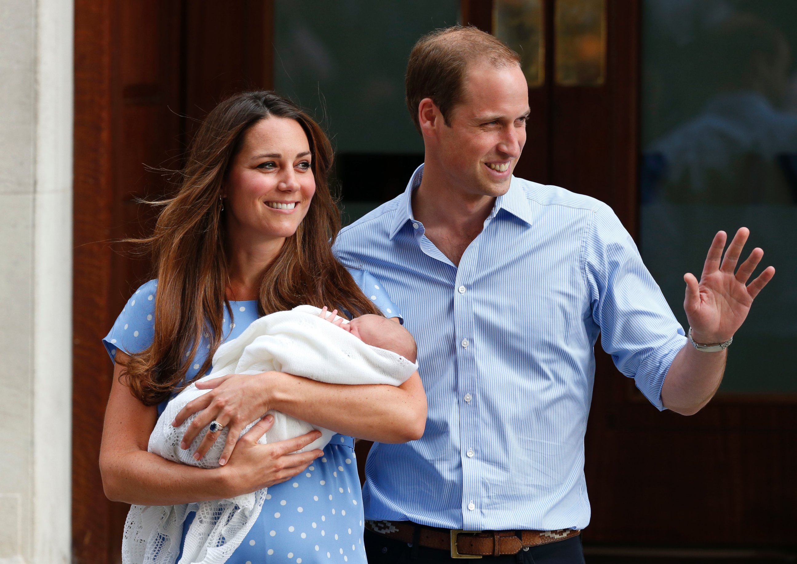 PHOTO: Britain's Prince William and Kate, Duchess of Cambridge hold the Prince of Cambridge, July 23, 2013, as they pose for photographers outside St. Mary's Hospital exclusive Lindo Wing in London where the Duchess gave birth.