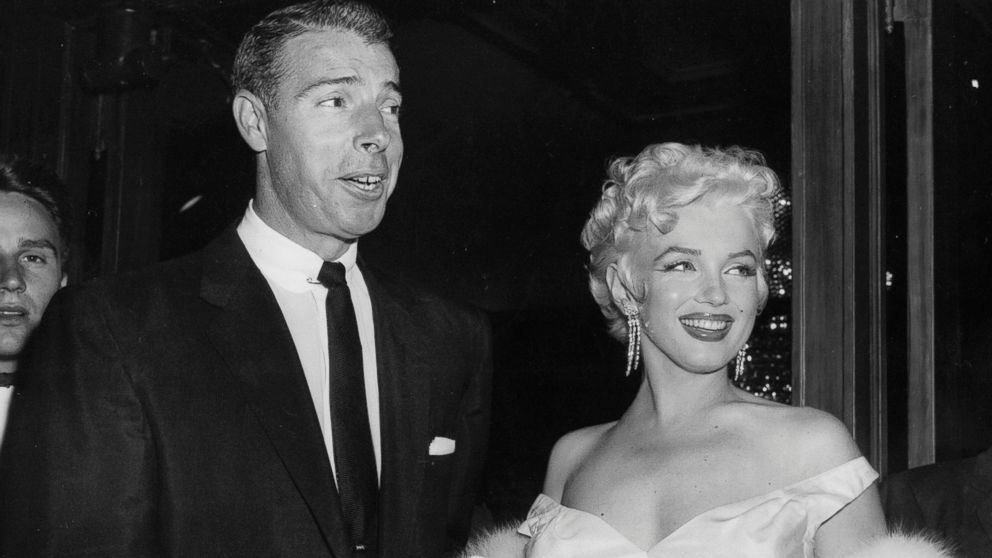 PHOTO: In this June 2, 1955 file photo, actress Marilyn Monroe, right, dressed in a glamorous evening gown, arrives with Joe DiMaggio at the theater. 