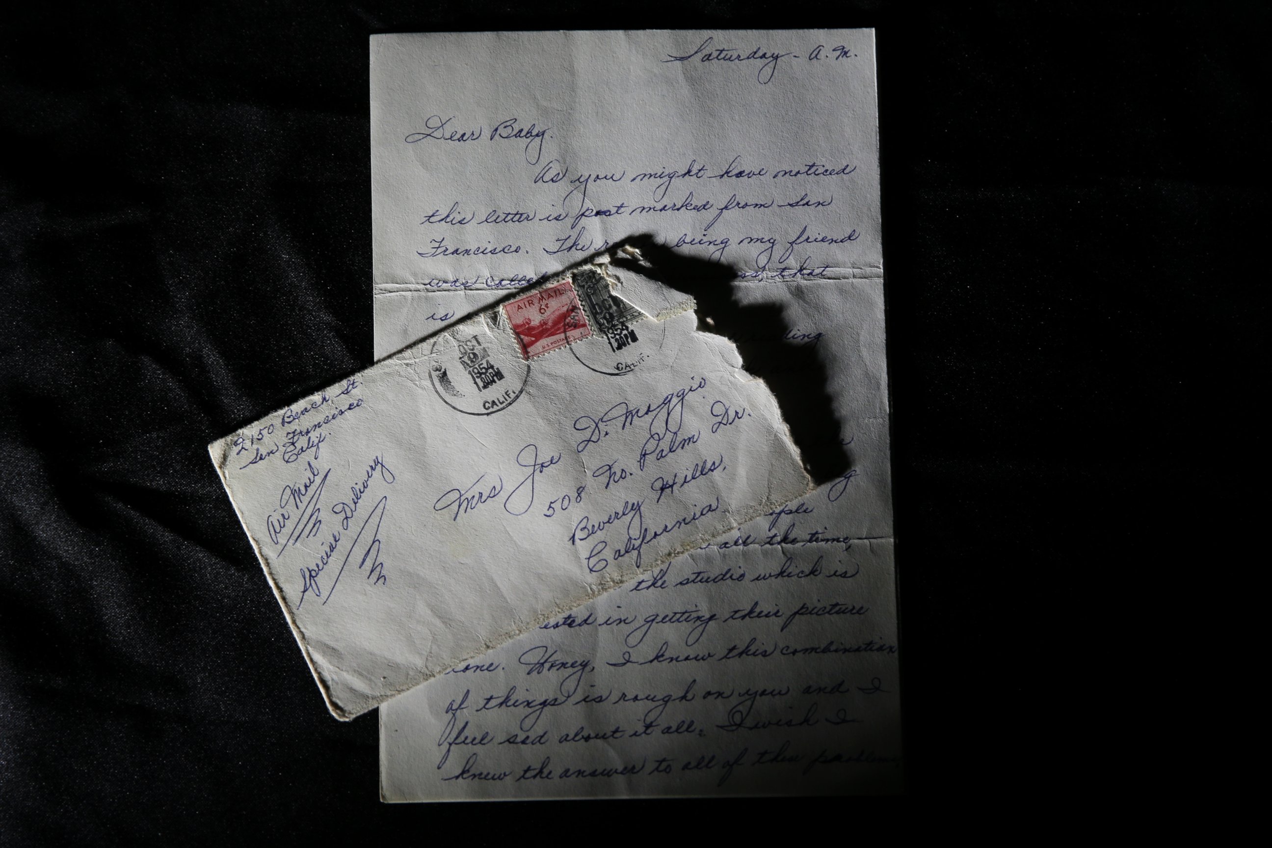PHOTO: This Nov. 7, 2014 photo shows part of a three-page handwritten letter and original envelope postmarked Oct. 9, 1954 from baseball legend Joe DiMaggio to Marilyn Monroe on display at Julien's Auctions in Beverly Hills, Calif.  