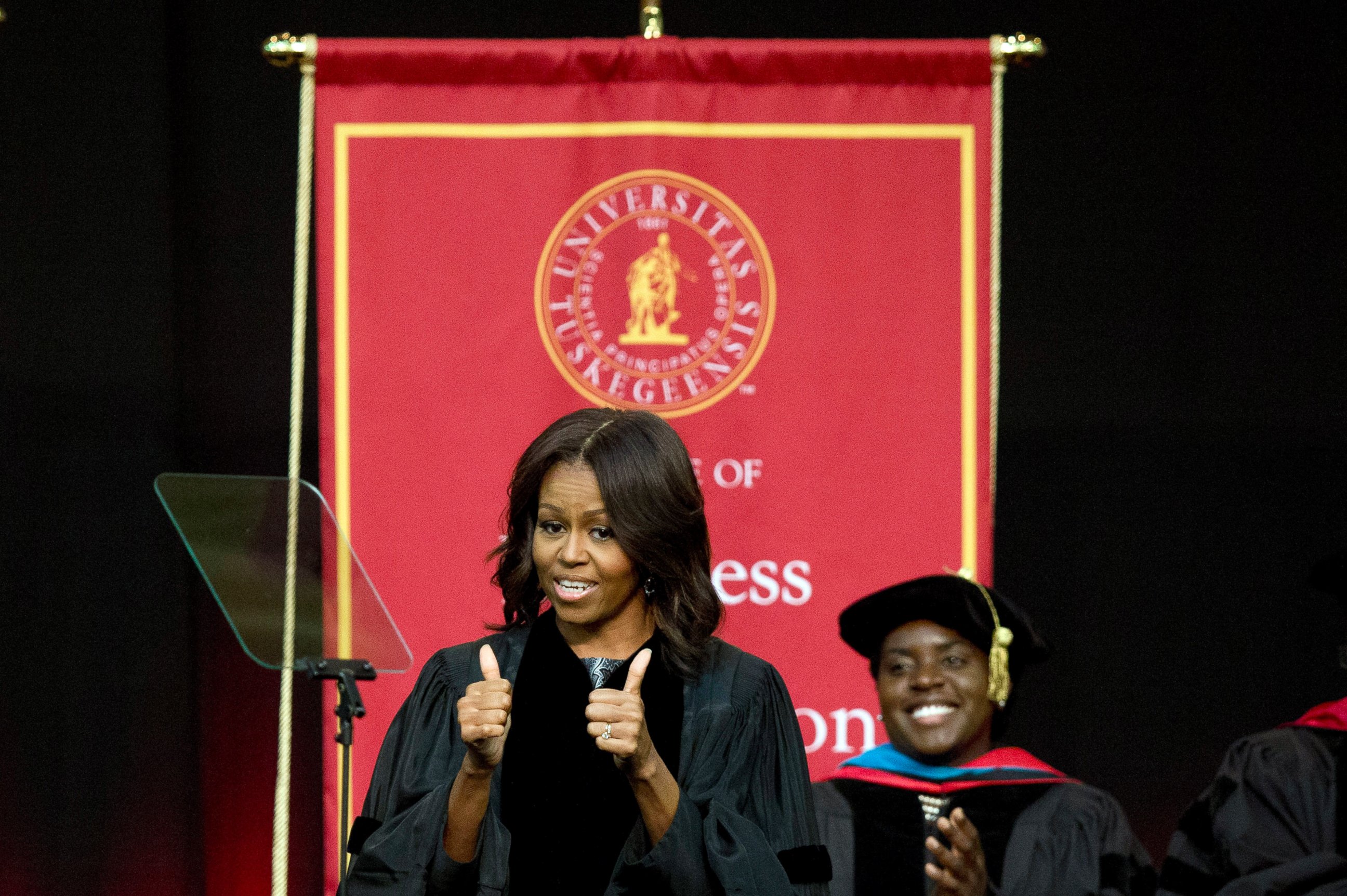 PHOTO: First lady Michelle Obama gives a thumbs up after walking out on stage just before delivering the commencement address at Tuskegee University, May 9, 2015, in Tuskegee, Ala. 