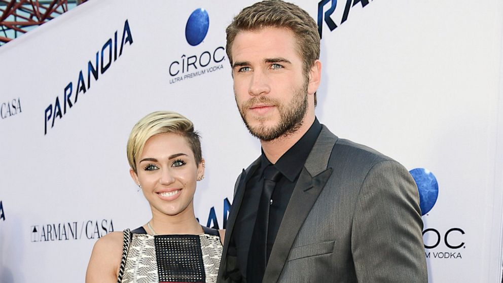 Liam Hemsworth and Miley Cyrus arrive on the red carpet at the U.S. premiere of the film "Paranoia" at the DGA Theatre, Aug. 8, 2013, in Los Angeles.