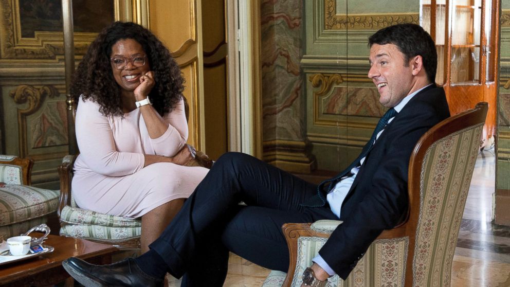 In this photo made available by Chigi Palace press office, Italian Premier Matteo Renzi meets with Oprah Winfrey at Chigi Palace premier's office in Rome, Oct. 15, 2015.