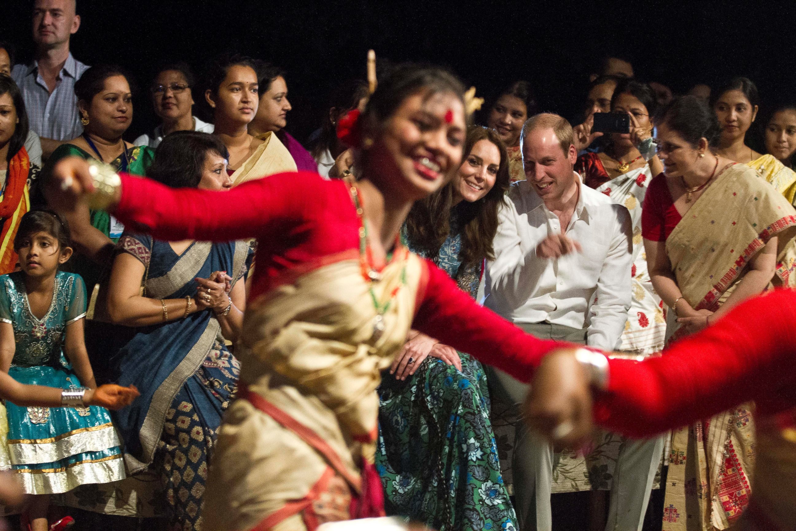 PHOTO: Britain's Prince William and Kate, the Duchess of Cambridge watch Assamese traditional dancers perform in Diphlu River Lodge in the Kaziranga National Park, northeastern Assam state, India, April 12, 2016.