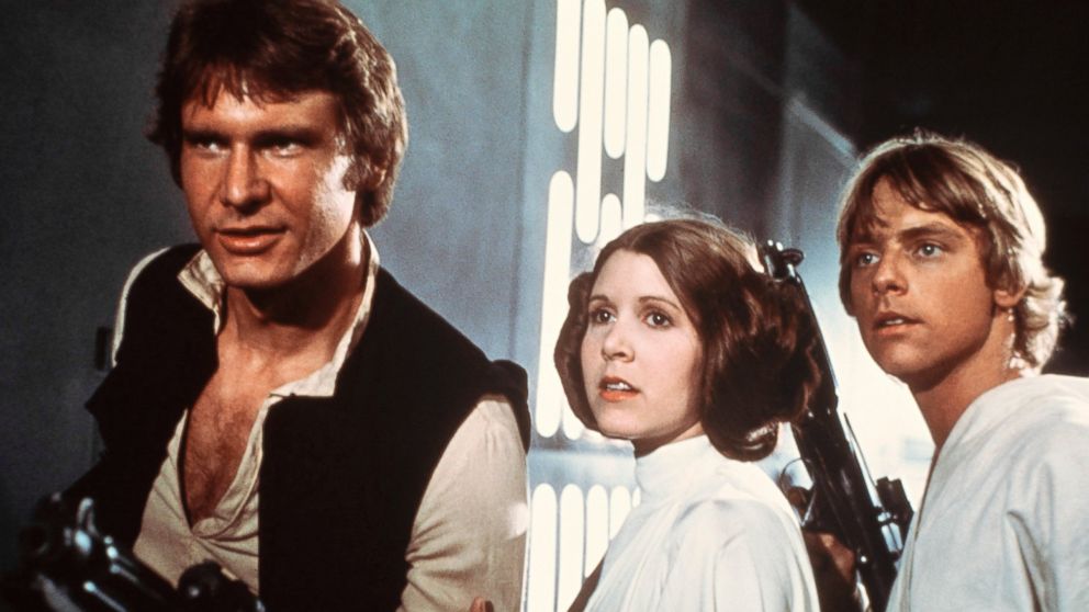Harrison Ford, as Han Solo, Carrie Fisher, as Princess Leia, and Mark Hamill, as Luke Skywalker in a scene from the 1977 movie, "Star Wars IV: A New Hope."