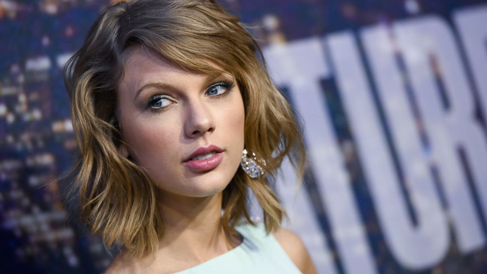In this Feb. 15, 2015 file photo, singer Taylor Swift attends the SNL 40th Anniversary Special in New York. Swift, Microsoft Corp. Harvard University are among those buying up .porn and .adult Web suffixes as a pre-emptive move before those domain names become available this summer.
