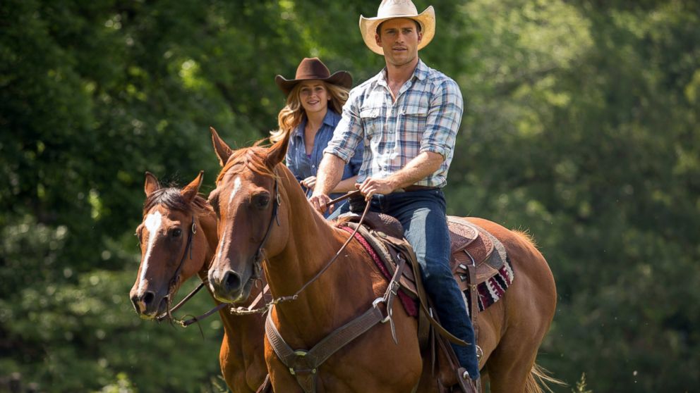 This photo provided by Twentieth Century Fox shows, Scott Eastwood as Luke, and Britt Robertson, as Sophia, in a scene from the film, "The Longest Ride."