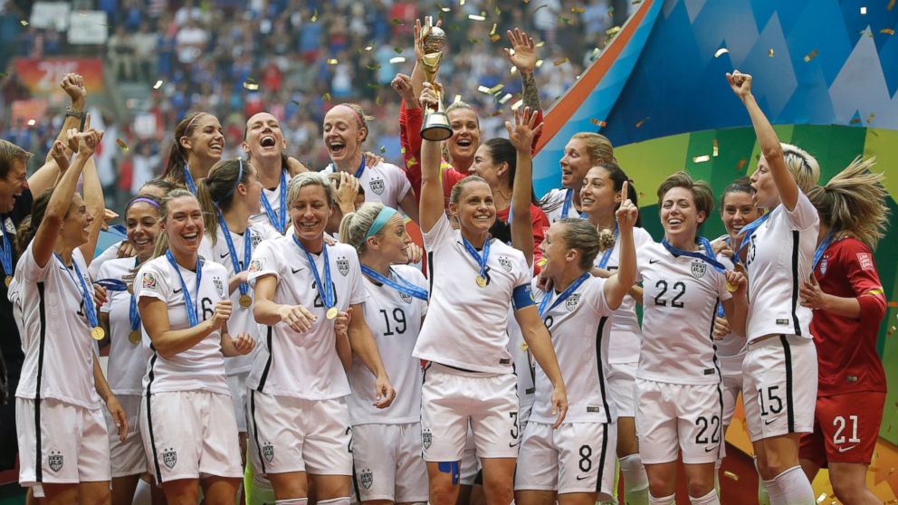 The United States Women's National Team celebrates with the trophy after they beat Japan in the FIFA Women's World Cup soccer championship, July 5, 2015, in Vancouver, Canada.