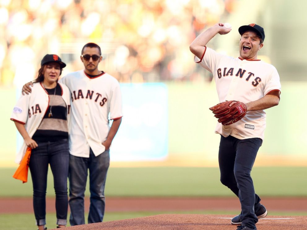 PHOTO: Zak Williams, son of Robin Williams, reacts after throwing out the ceremonial first pitch before Game 5 of baseball's World Series between the Kansas City Royals and the San Francisco Giants, Oct. 26, 2014, in San Francisco.