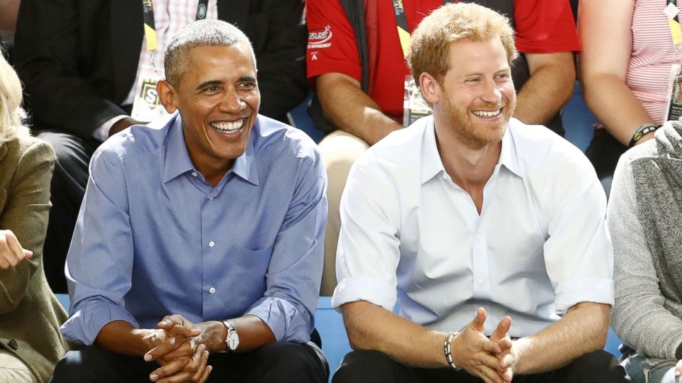 Britain's Prince Harry (R) and former President Barack Obama watch a wheelchair basketball event during the Invictus Games in Toronto, Sept. 29, 2017.   