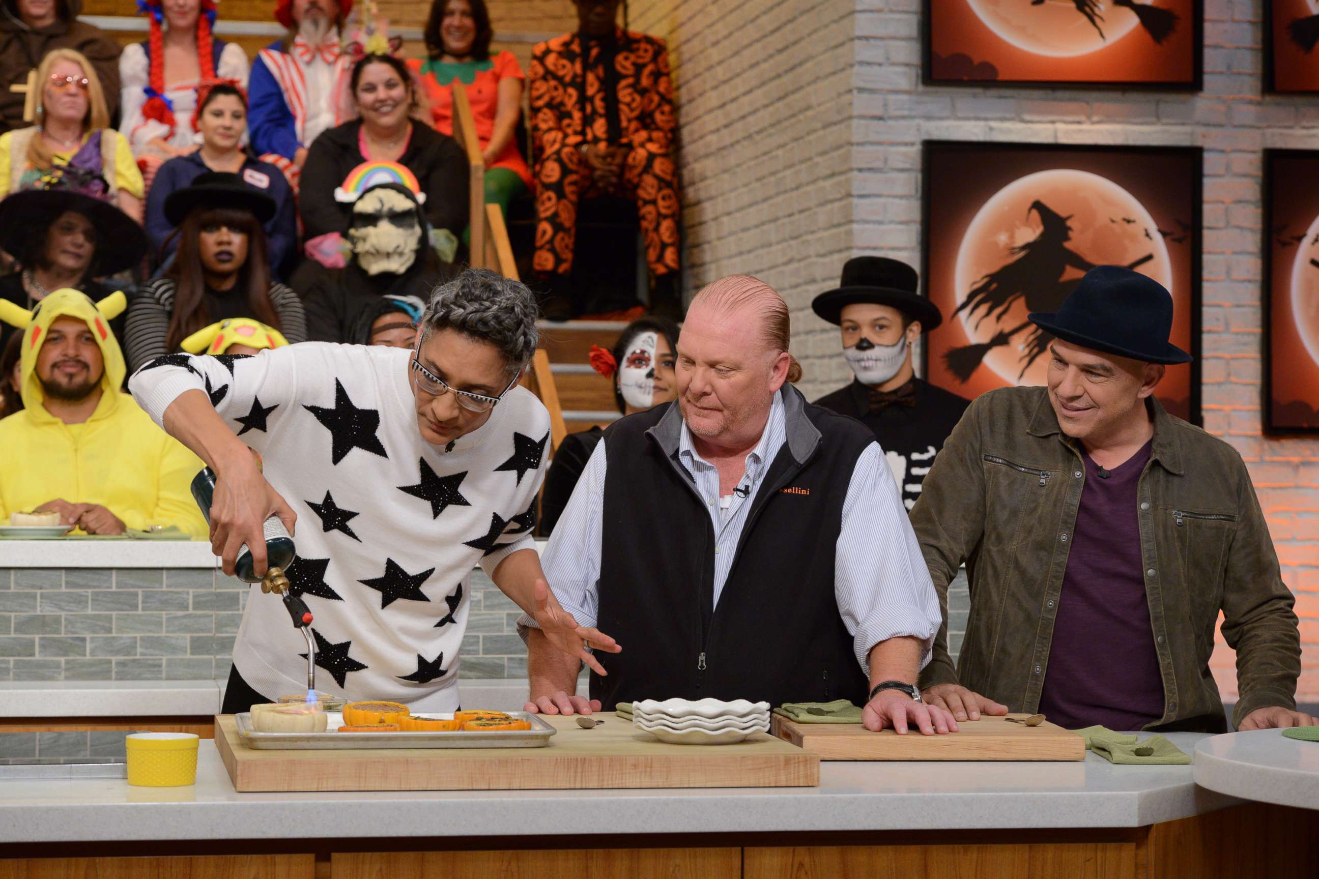 PHOTO: Carla Hall, Mario Batali, and Michael Symon shown on "The Chews Halloween Bash" which aired on October 31, 2017on ABC.  