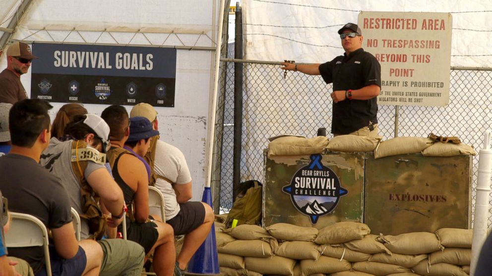 PHOTO: Contestants get instructions on surviving the challenge.