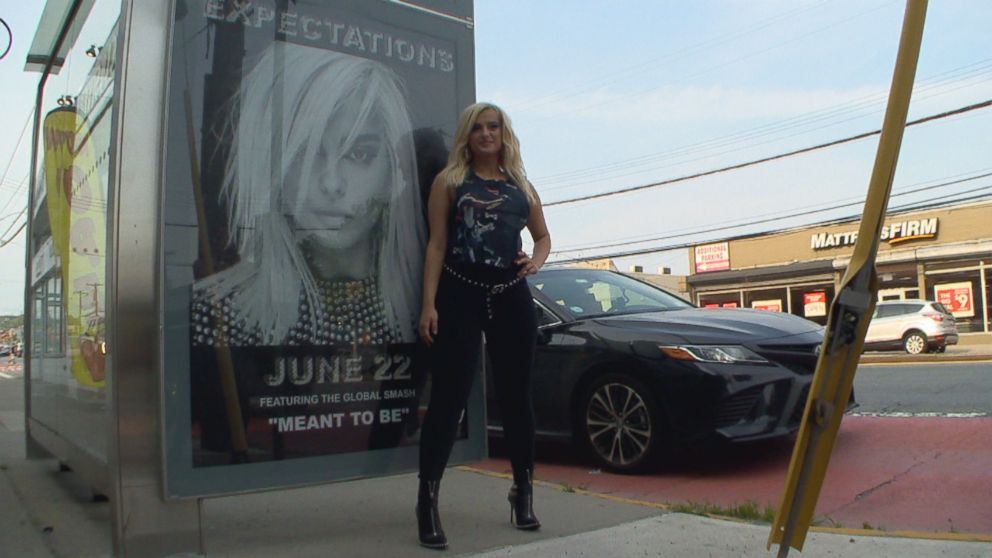 PHOTO: Bebe Rexha posed in front of a billboard that was barely five blocks away from her childhood home.