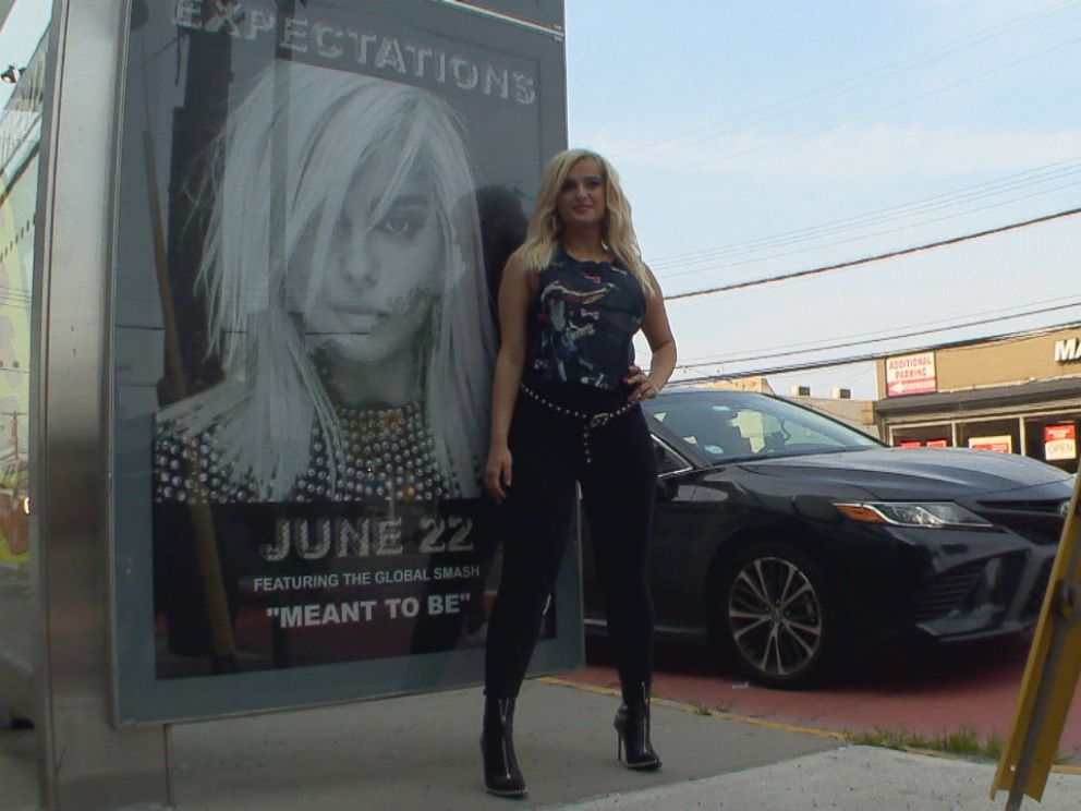 PHOTO: Bebe Rexha posed in front of a billboard that was barely five blocks away from her childhood home.