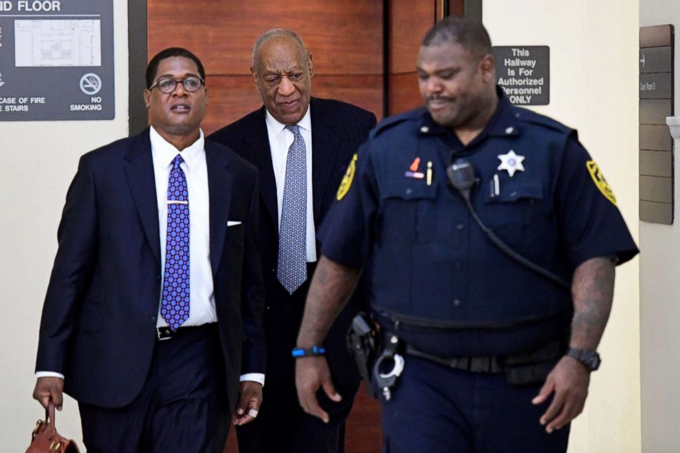 PHOTO: Bill Cosby, walks back to courtroom C with spokesperson Andrew Wyatt, from a break during his  sexual assault retrial at the Montgomery County Courthouse in Norristown, PA, April 4, 2018. 