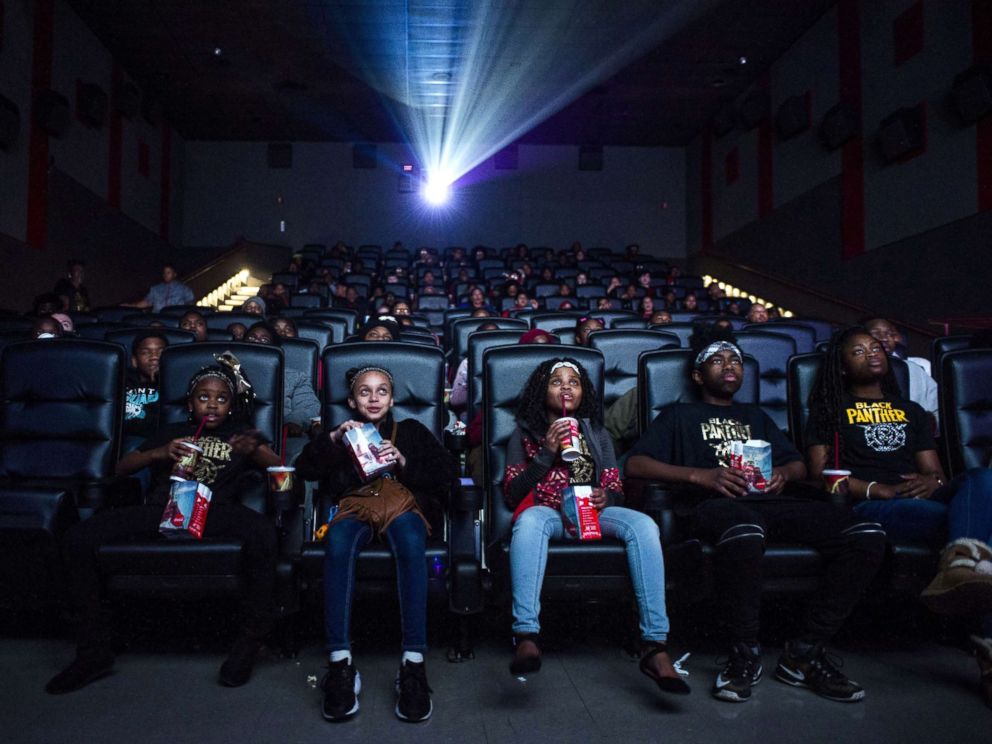 PHOTO: Mari Copeny, third from left, watches a free screening of the film "Black Panther" with more than 150 children, after she raised $16,000 to provide free tickets in an entire theater, Feb. 19, 2018, in Flint Township, Mich. 