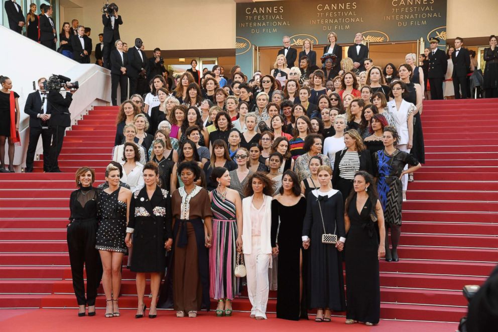 PHOTO: Jury head Cate Blanchett with other filmmakers reads a statement on the steps of the red carpet in protest of the lack of female filmmakers honored throughout the history of the festival during the Cannes Film Festival, May 12, 2018 in Cannes.