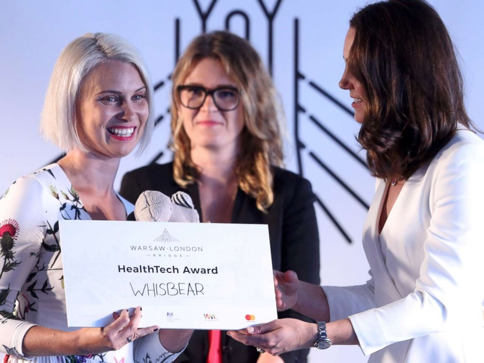 PHOTO: Britain's Catherine, Duchess of Cambridge awards Zuzanna Sielicka-Kalczynska from the Whisbear The Humming Bear company with the Health Tech Award at the Heart business incubator in the Warsaw Spire building in Warsaw, Poland, July 17, 2017.