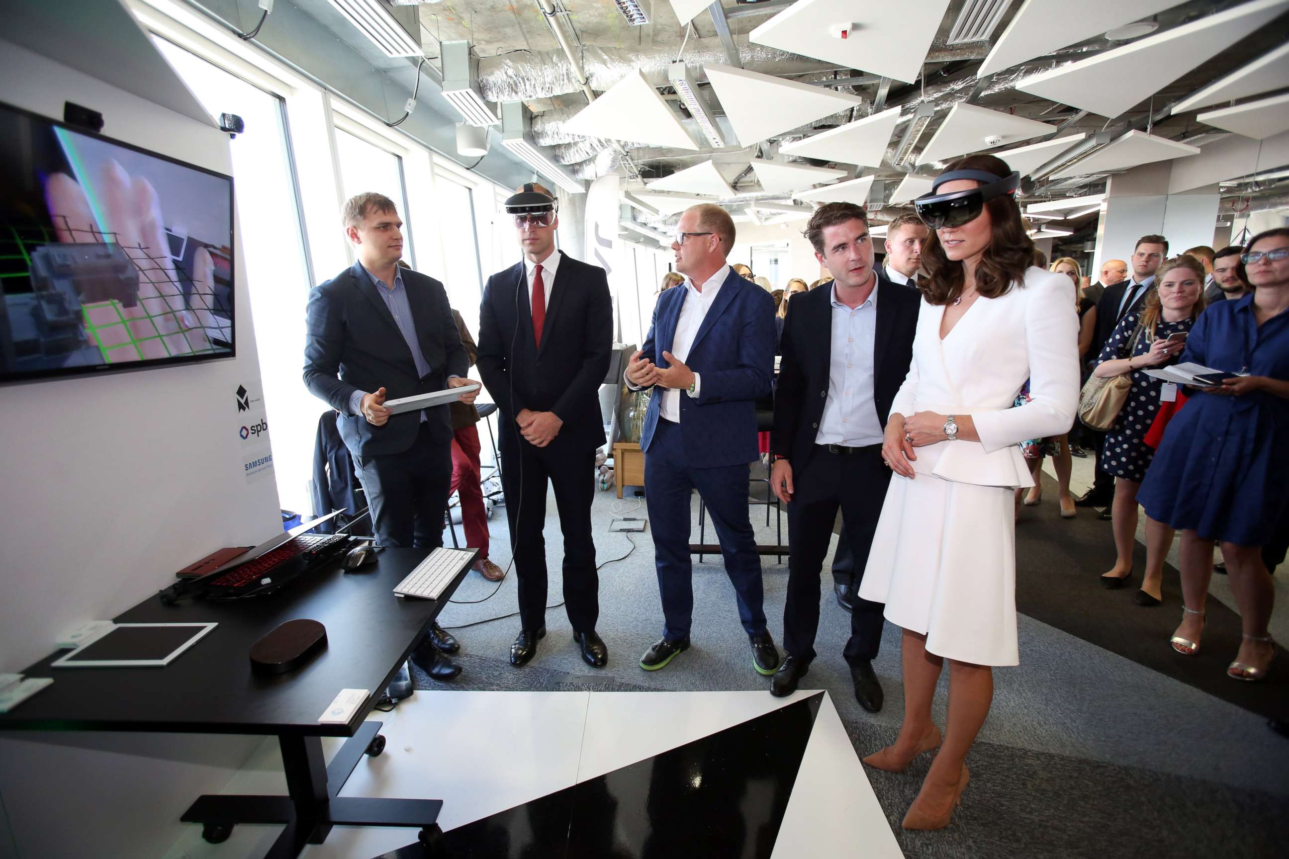 PHOTO: Britain's Prince William and Duchess Catherine look through a virtual reality goggles as they meet with young Polish entrepreneurs at the Heart business incubator in the Warsaw Spire building in Warsaw, Poland, July 17, 2017.