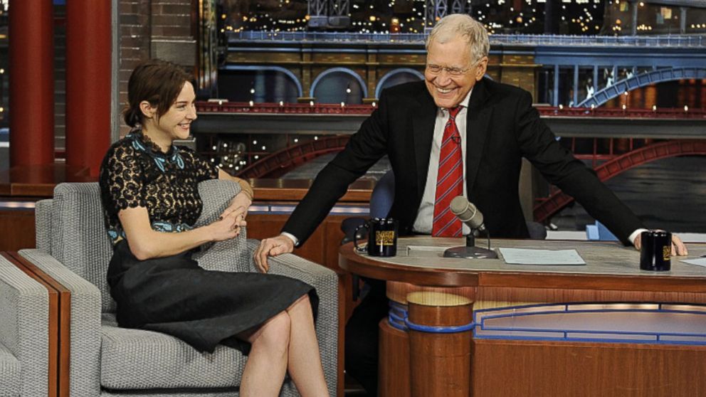 PHOTO: Actress Shailene Woodley shares a laugh with David Letterman when she visits the Late Show with David Letterman,  March 16, 2015.
