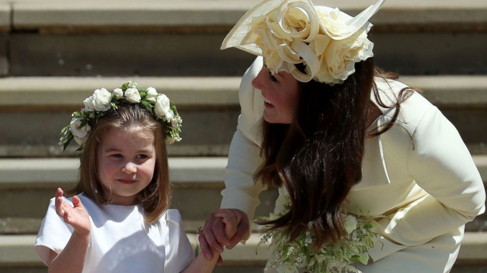 PHOTO: Princess Charlotte waves by her mother Britain's Catherine, Duchess of Cambridge after attending the wedding ceremony of Britain's Prince Harry and Meghan Markle at St George's Chapel in Windsor, May 19, 2018.