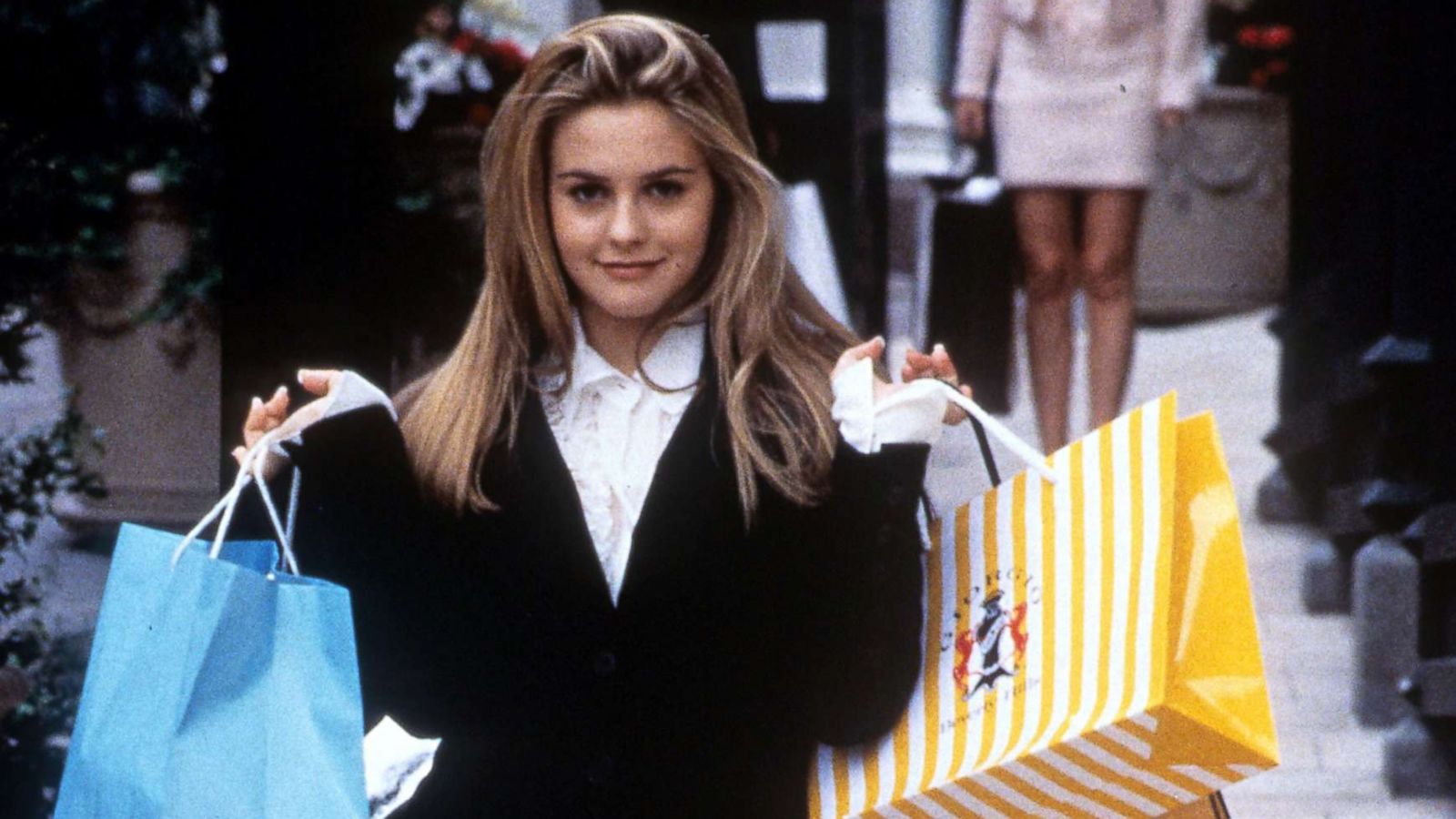 PHOTO: Alicia Silverstone holds shopping bags in a scene from the film "Clueless," 1995.