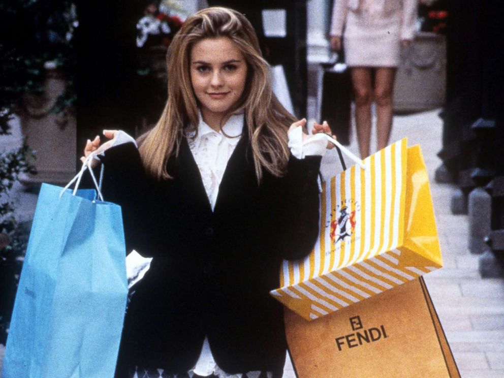 PHOTO: Alicia Silverstone holds shopping bags in a scene from the film Clueless, 1995.