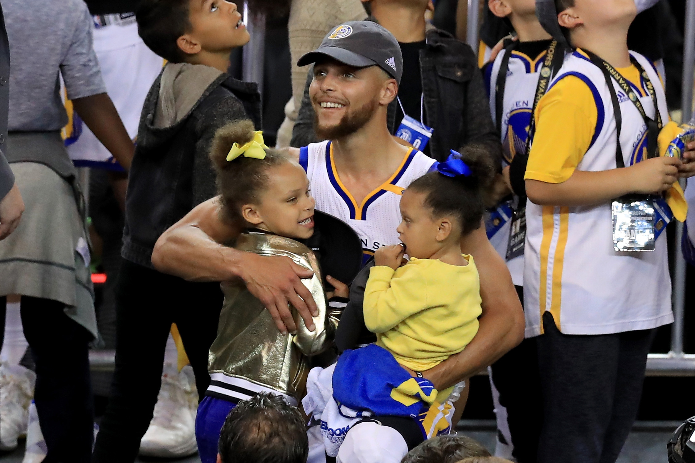 PHOTO: Stephen Curry of the Golden State Warriors celebrates holding his daughters Riley and Ryan after defeating the Cleveland Cavaliers 129-120 in Game 5 to win the 2017 NBA Finals at ORACLE Arena, June 12, 2017, in Oakland, Calif.