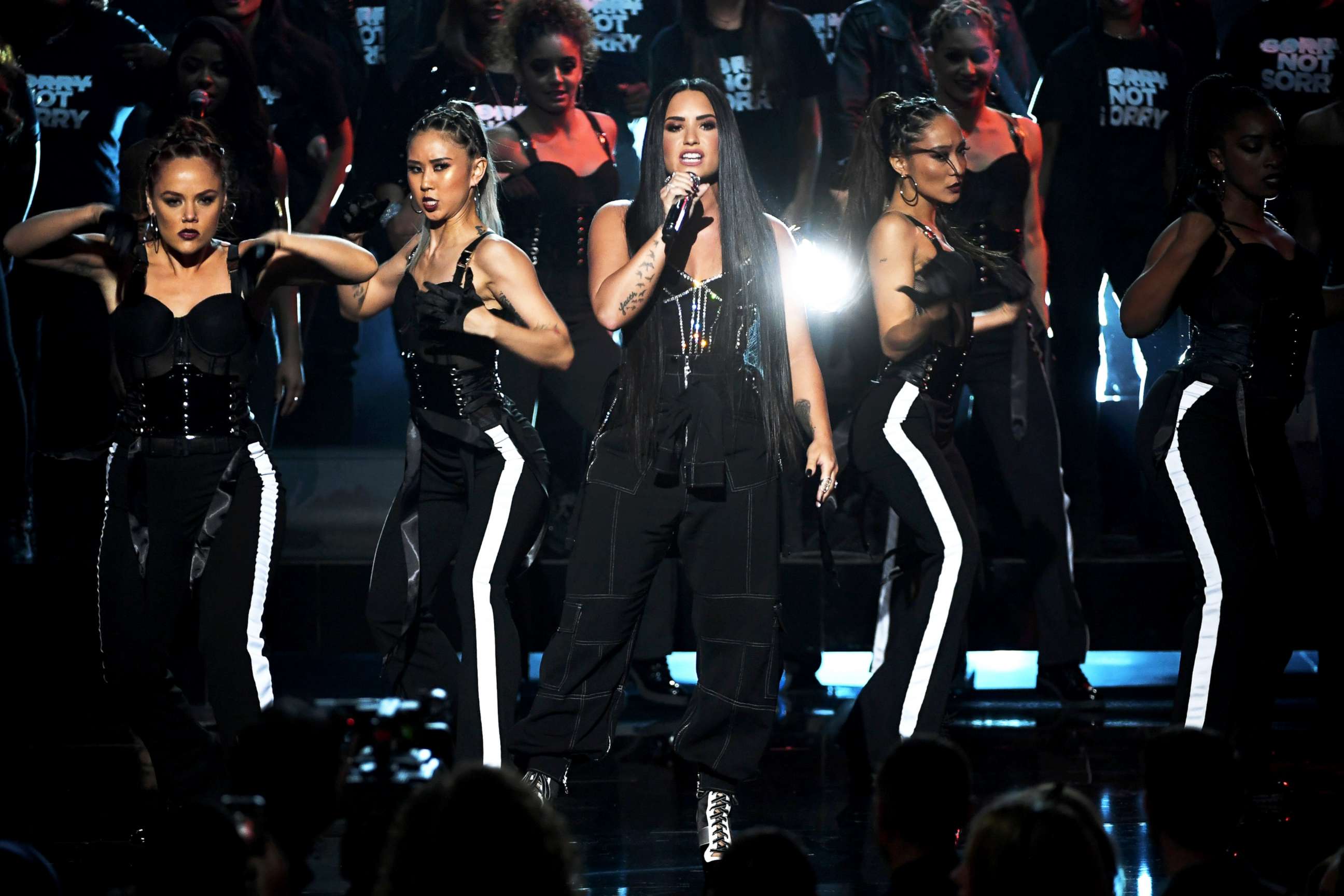 PHOTO: Demi Lovato, center, performs onstage during the 2017 American Music Awards at Microsoft Theater, Nov. 19, 2017, in Los Angeles.