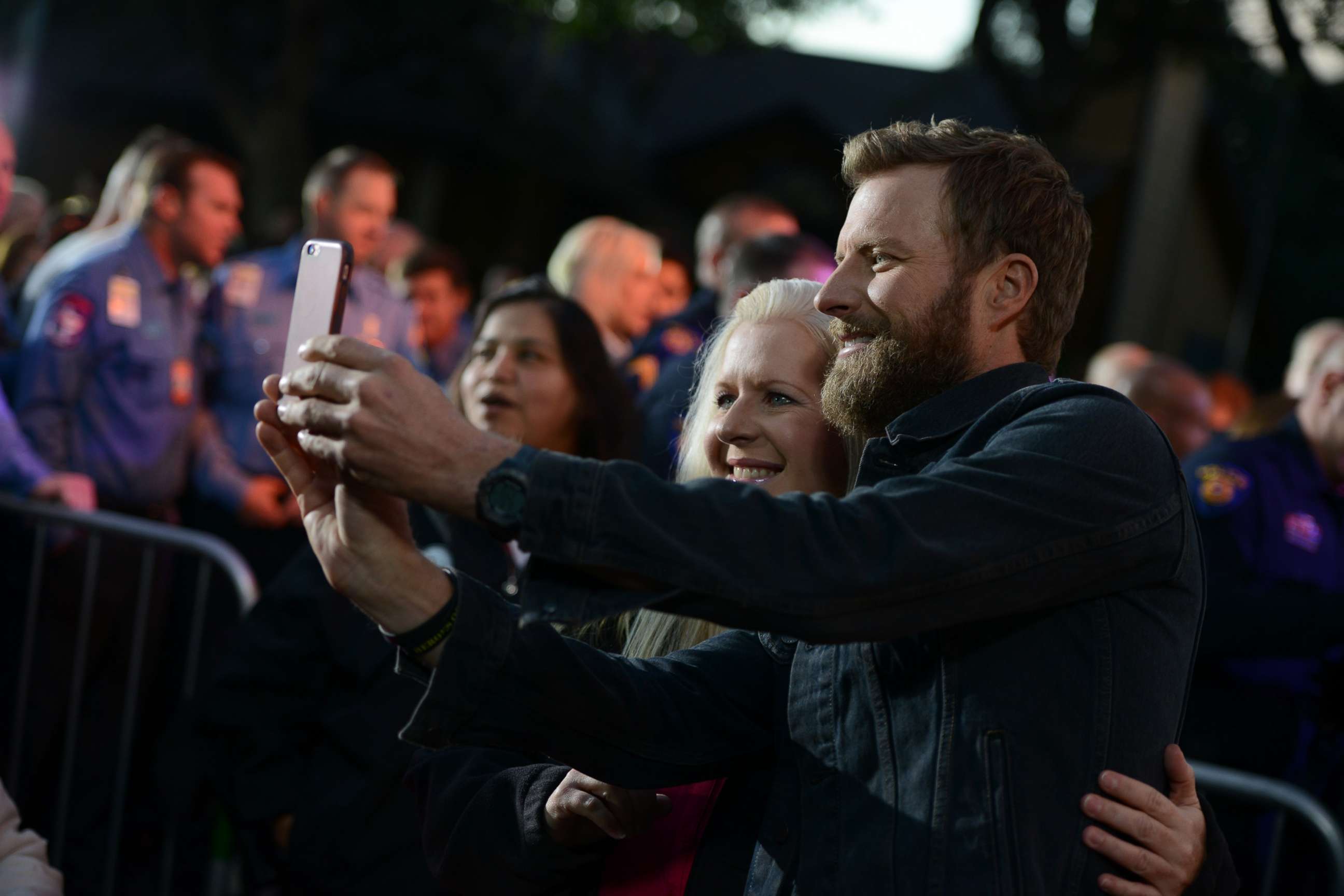 PHOTO: Country music star Dierks Bentley poses with a neighbor during the block party in Austin, Texas, Oct. 17, 2017.