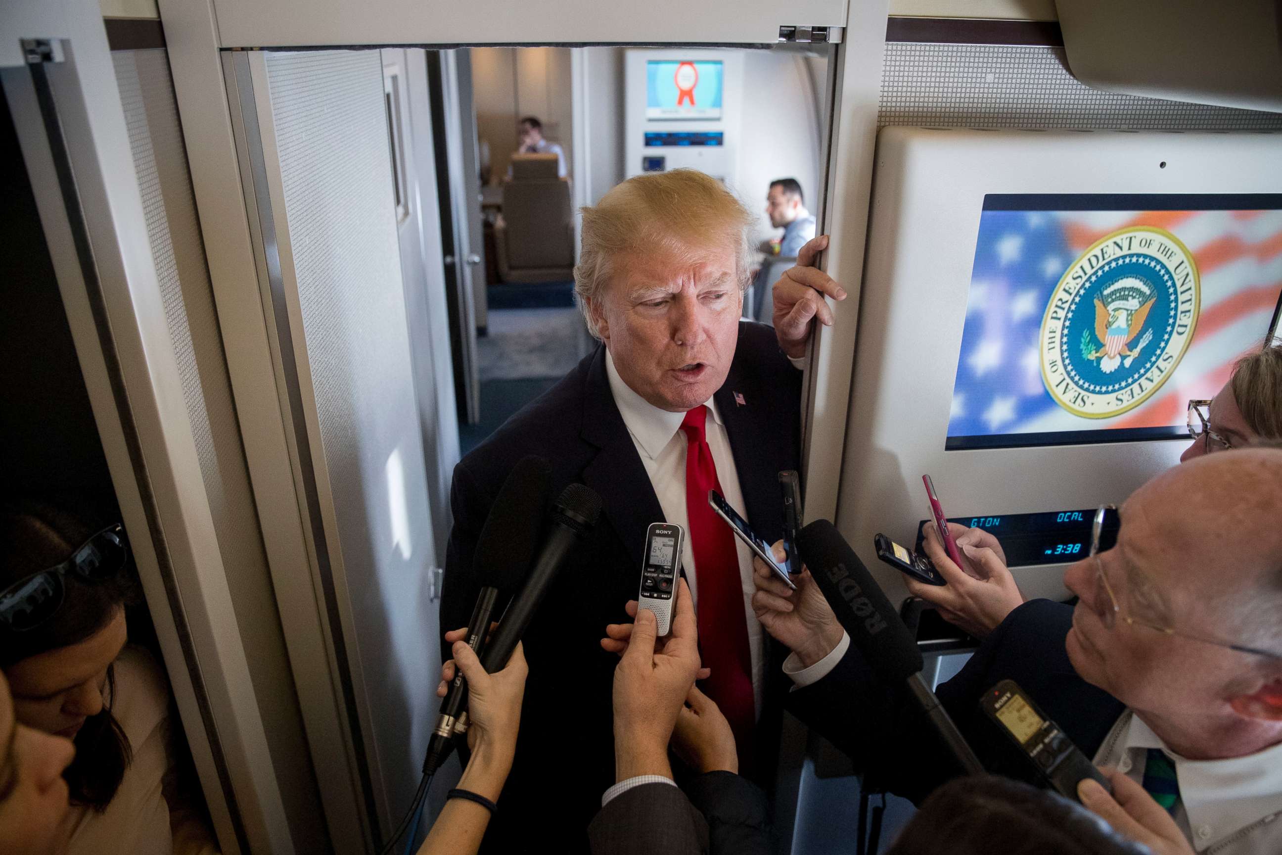 PHOTO: President Donald Trump speaks to reporters aboard Air Force One, Saturday, Nov. 11, 2017, while traveling to Hanoi, Vietnam.