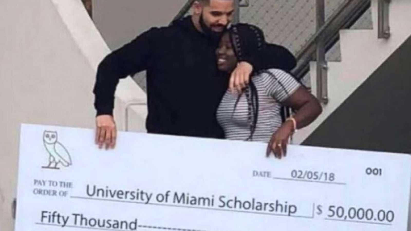 PHOTO: Drake presented Destiny James with a $50,000 check at the University of Miami, Feb. 6, 2018.