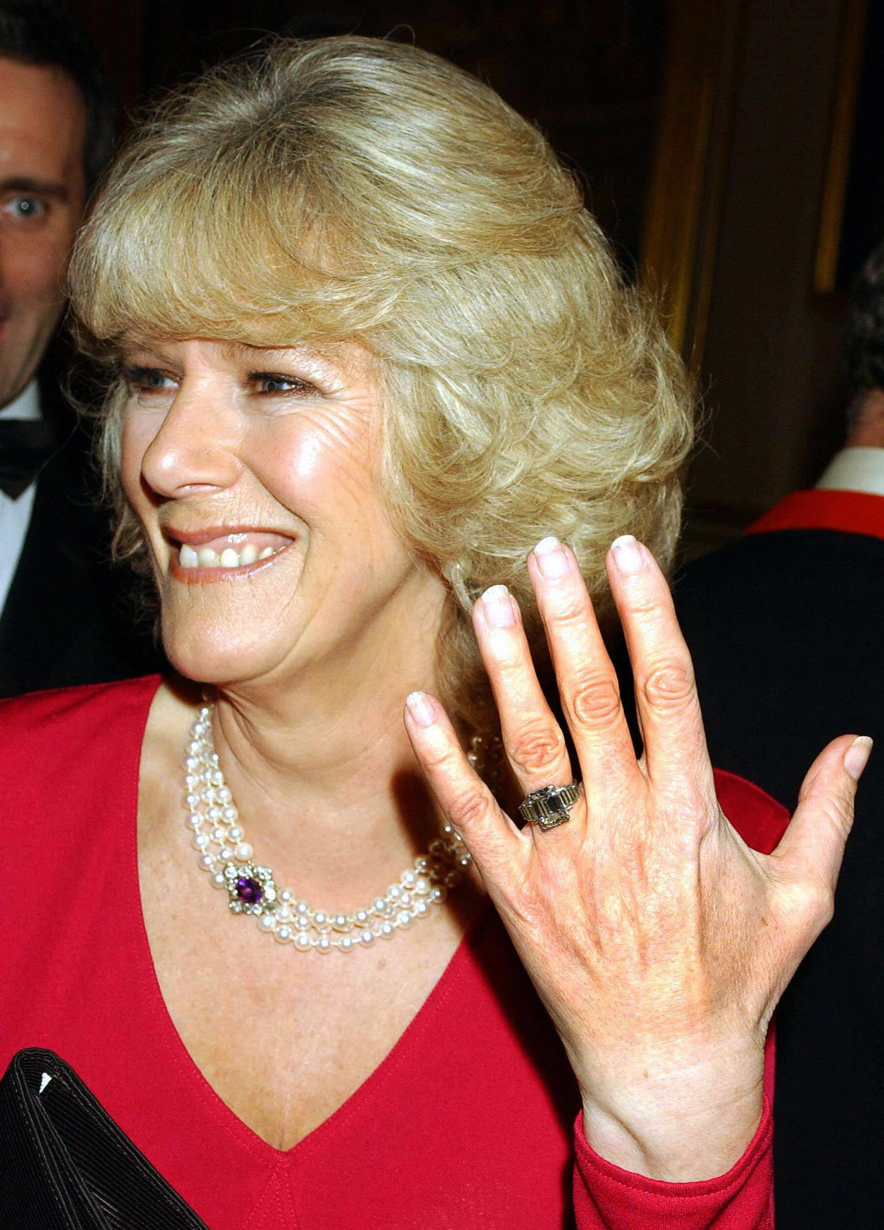 PHOTO: Camilla Parker Bowles shows off her engagement ring as she and Prince Charles arrive for a party at Windsor Castle after announcing their engagement earlier on Feb. 10, 2005.  