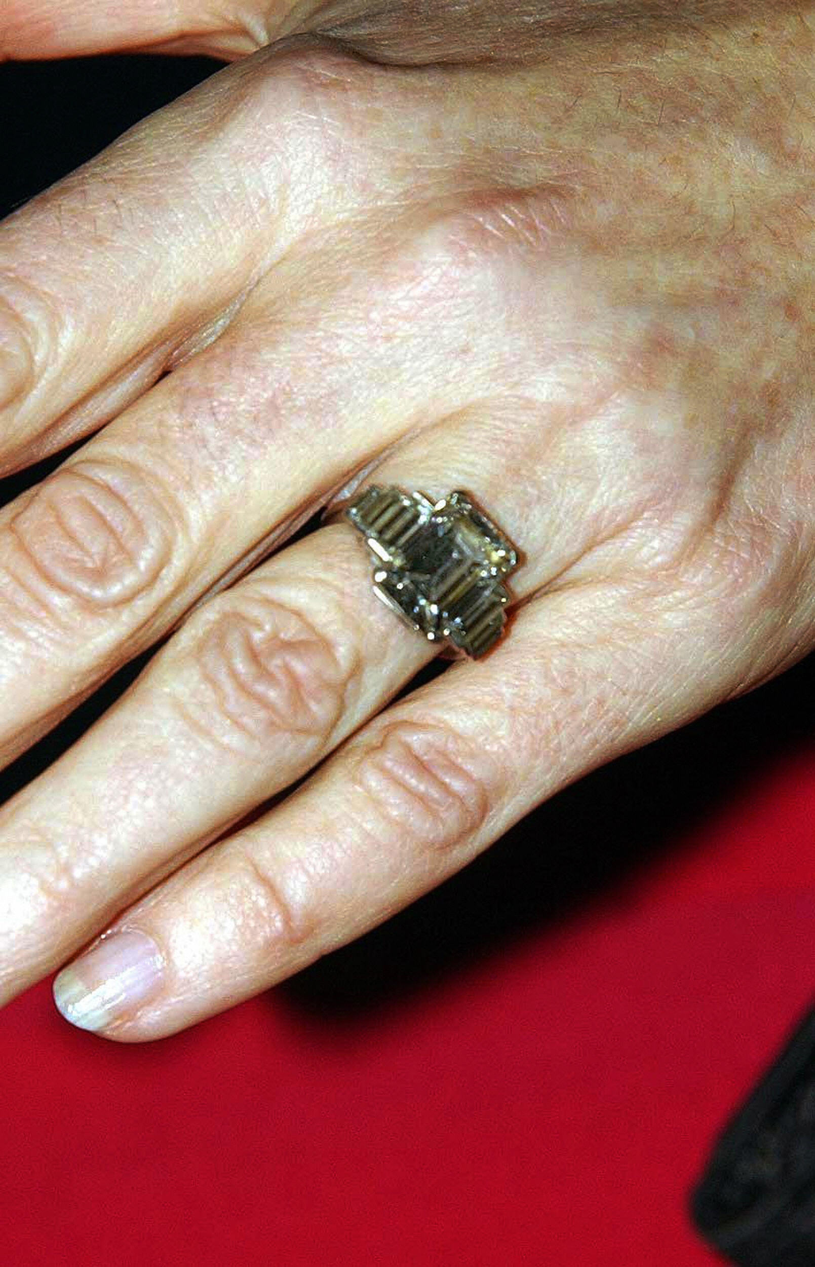 PHOTO: Camilla Parker Bowles shows off her engagement ring as she and Prince Charles arrive for a party at Windsor Castle after announcing their engagement earlier on Feb. 10, 2005.  