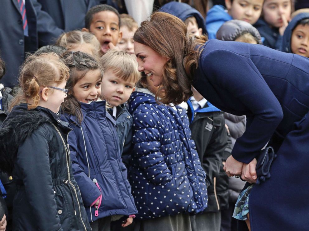 Pregnant Princess Kate visits with schoolchildren a day after ...