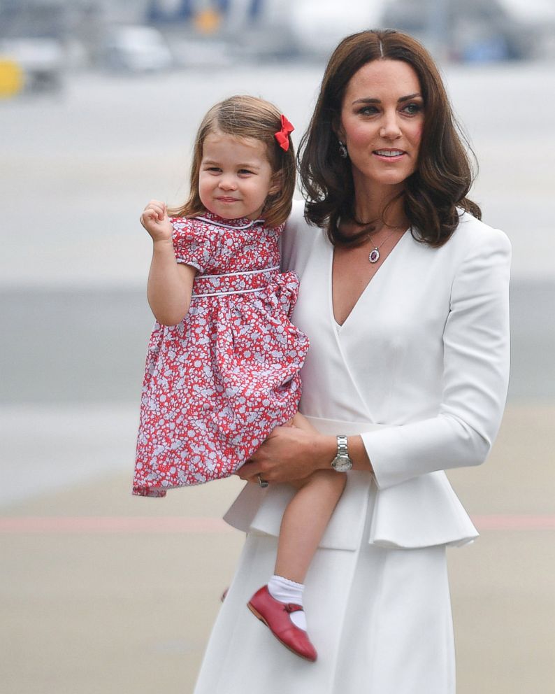 PHOTO: Catherine, Duchess of Cambridge (R) with her daughter Princess Charlotte (L) at the airport in Warsaw, Poland, July 17, 2017. 