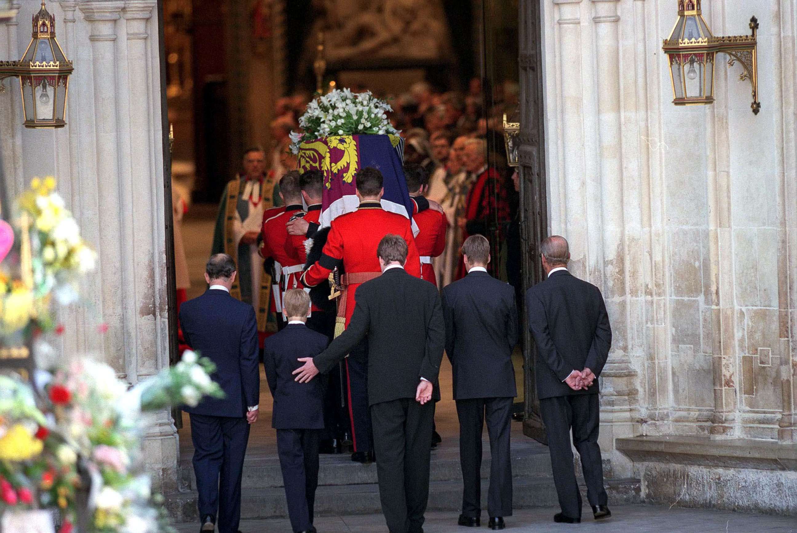 PHOTO: Earl Spencer touches Prince Harry as they follow the coffin of Diana, Princess of Wales at her funeral, Sept. 6, 1997.