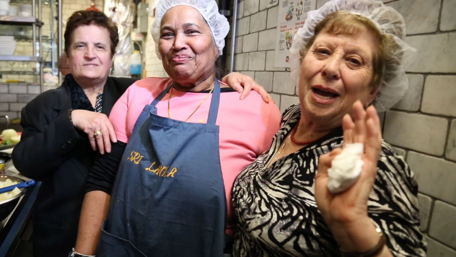 PHOTO: From left to right, Ploumitsa Zimnis, May "Dolly" Joseph and Maria Giannella, cook together in the kitchen of Enoteca Maria restaurant in New York City.