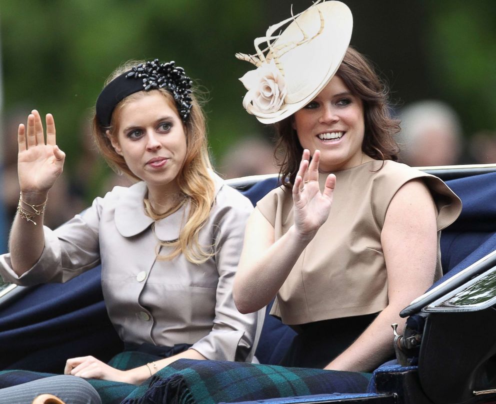 PHOTO: From left, Princess Beatrice of York and Princess Eugenie of York wave at the crowd during the annual Trooping The Colour ceremony at Horse Guards Parade on June 13, 2015 in London, England.