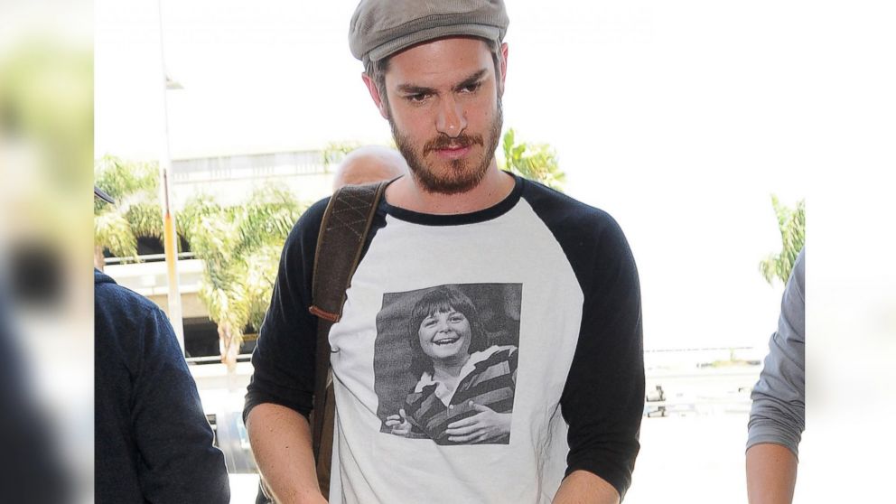 Andrew Garfield arrives at LAX airport wearing a shirt featuring a photo of Michael J. Fox in Los Angeles, Calif. on June 11, 2014.