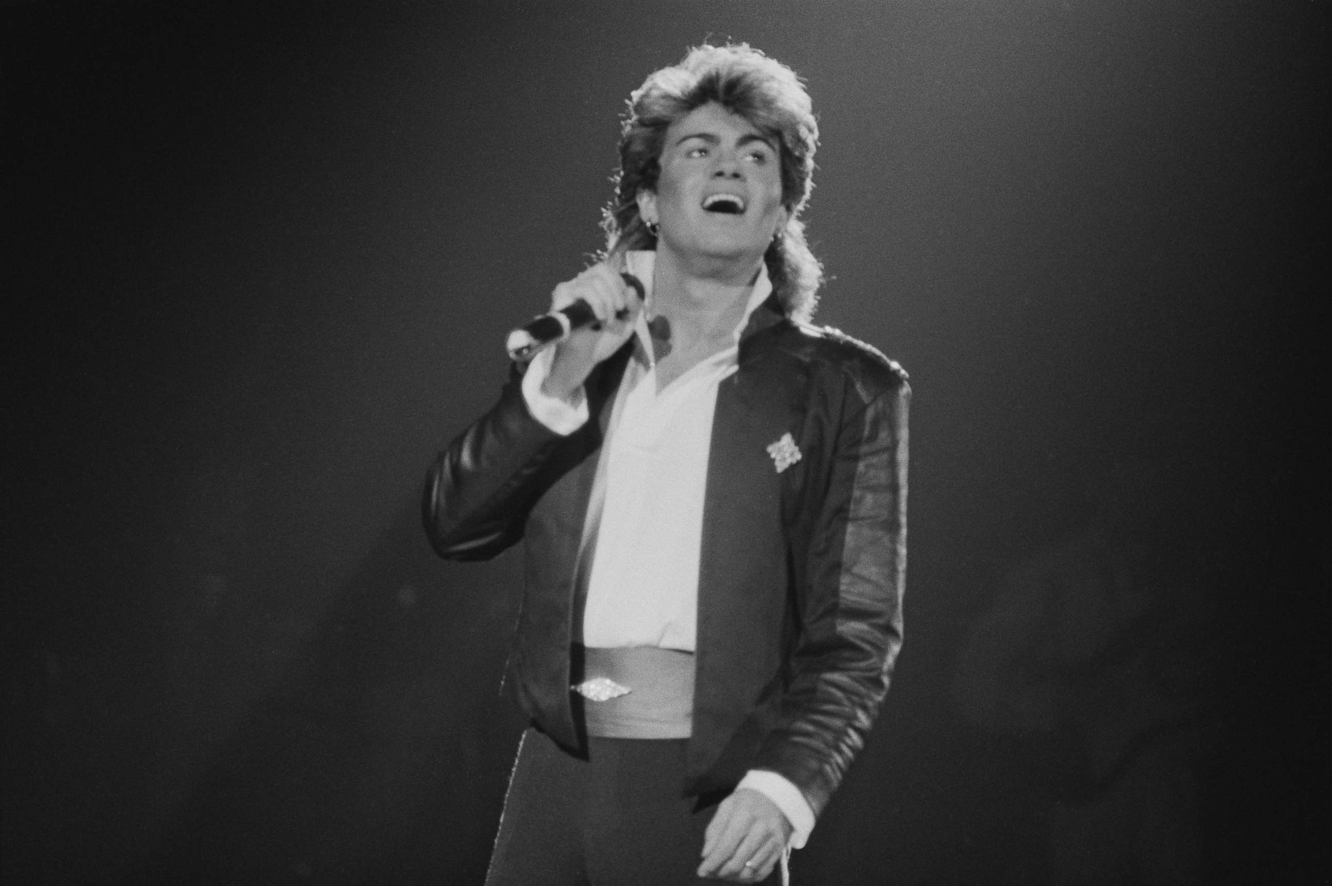 PHOTO: Singer-songwriter George Michael of Wham!, performing on stage during the pop duo's 1985 world tour, Jan. 1985.
